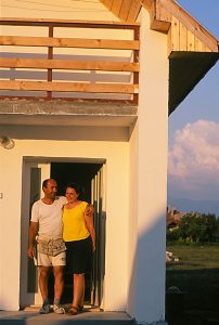 Elizabeth Nicoleta Mara and Ioan Ovidiu Mara in the doorway of their Habitat house. (Romania Eclipse Build 1999)