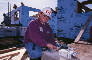Tracy Hill, volunteer from Ontario, Canada, works on a Habitat house. (Women Building a Legacy 2001)