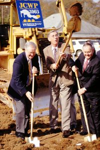 Tommy Greshan, Millard Fuller, and Dr. Tom Malone break ground at the Hillside Place build site, one of two Jimmy Carter Work Project 2003 sites in LaGrange, Georgia. (2002) (Habitat World, October/November 2003, p.3 & 4)
