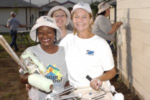 Future Habitat homeowner Angela Brown (left) with volunteers Vicki Coley, an employee of Clear Channel, and Sherry Whitener, a Clear Channel radio John Mayer concert contest winner. (2004)