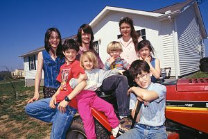 William and Cheryl Dile and their children in front of their Habitat house. (1997)