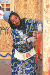 Marian Nur, a homeowner's mother, helps to build her daughter's Habitat home during '98 Building on Faith week in Seattle, Washington. (1998)