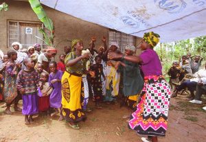 Habitat homeowner Devota Venice, right, dances with a neighbor at the dedication of her Habitat house. (2002)