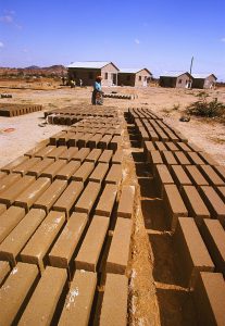 Pressed-earth blocks dry in the sun at a Habitat build site in Dodoma. (2002)