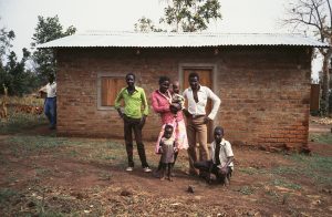 A family is pictured outside of their Habitat house. (2001)